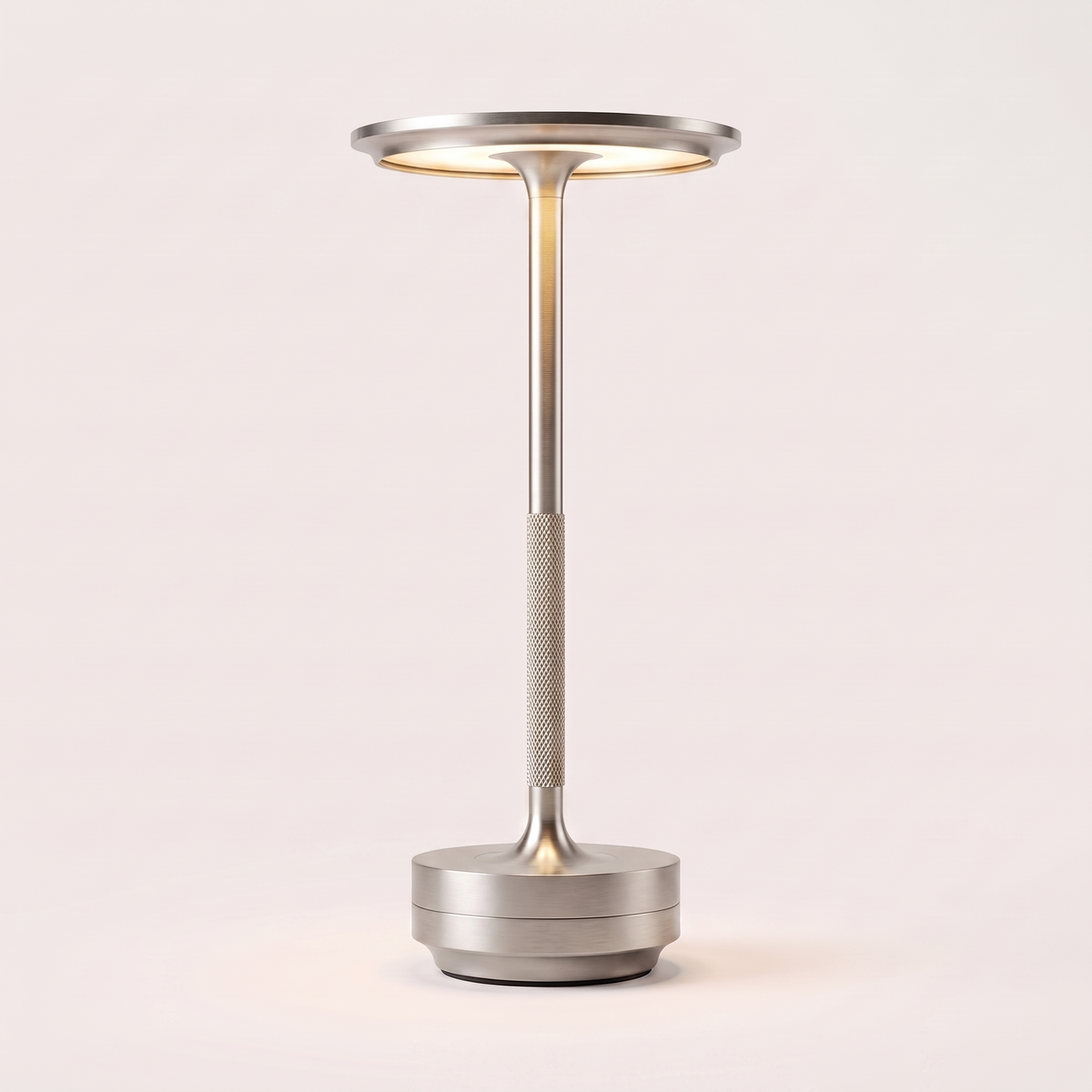 Eclara Ilumina cordless table lamp in brushed silver, flat disc head with warm LED, knurled stem and stepped base