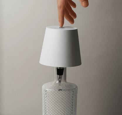 Eclara Bodega portable bottle lamp giving soft warm light, no cables